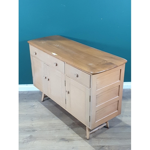 587 - An Ercol Sideboard fitted two frieze drawers above three cupboard doors 3ft 11in W x 2ft 8in H (R7)