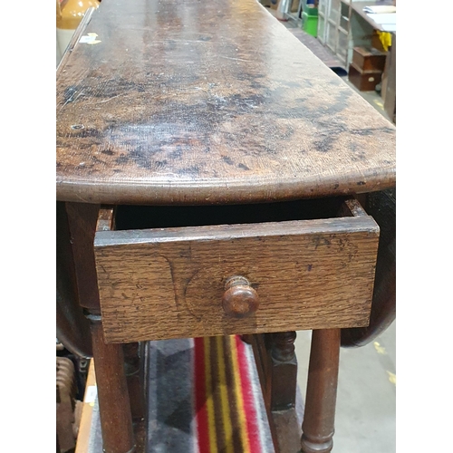 590 - An 18th Century oak Gateleg Table fitted end drawer mounted on turned supports 3ft 4in W x 2ft 4in H... 