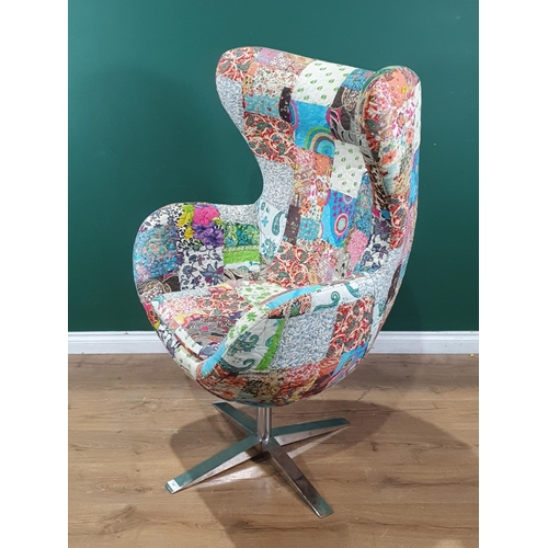 597 - An Egg Swivel Chair in patchwork upholstery on polished chrome support. (R7).