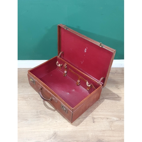 632 - A vintage leather Suitcase. (R6).