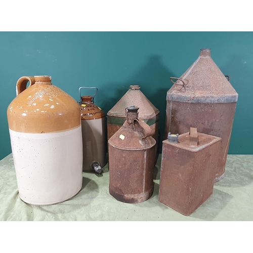 691 - Two large stoneware Flagons, two Oil Cans, another metal Can and a Shell Petrol Can (R8)