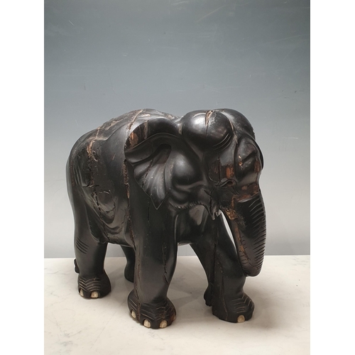 7 - An ebony carving of an elephant A/F, 1ft H (R8)