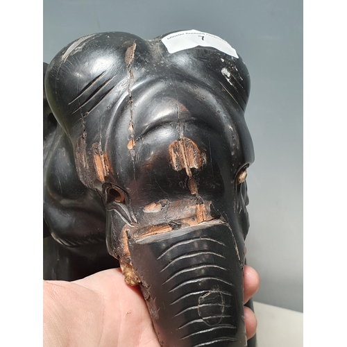 7 - An ebony carving of an elephant A/F, 1ft H (R8)