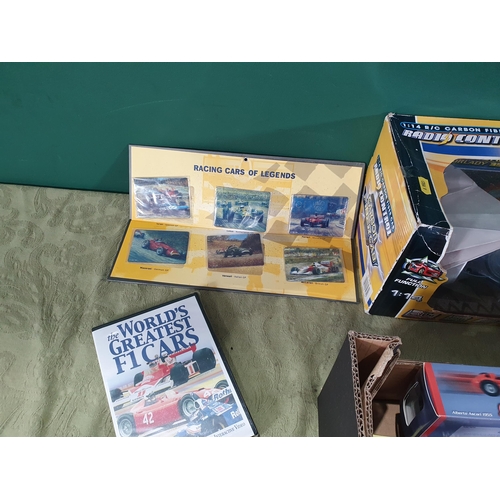 704 - A radio controlled Car and a box of boxed Grand Prix Racing Car (R10)