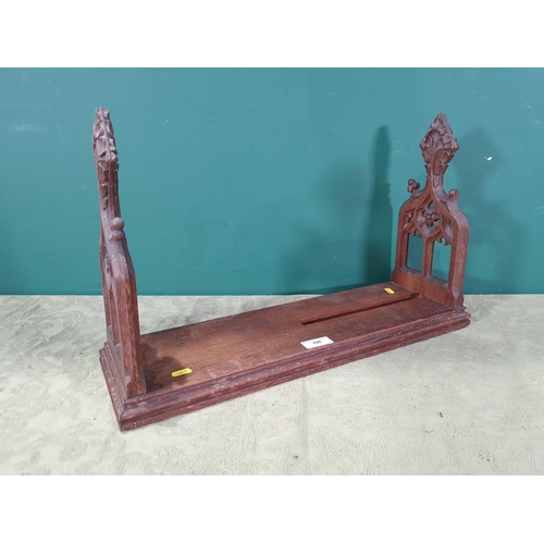 708 - An oak Bookstand with pierced tracery designed ends, 23in (R9)