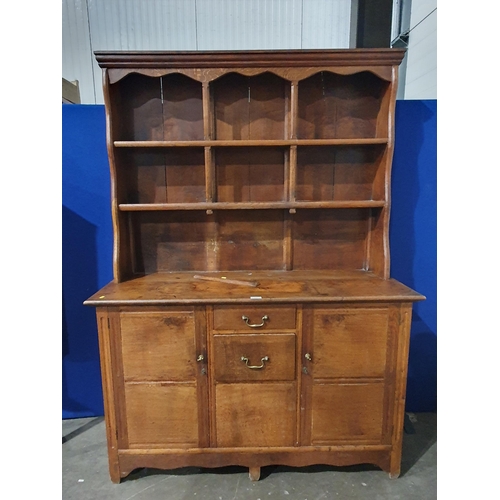 717 - An antique oak Dresser and rack the base fitted pair of cupboard doors flanking two drawers 6ft 7in ... 