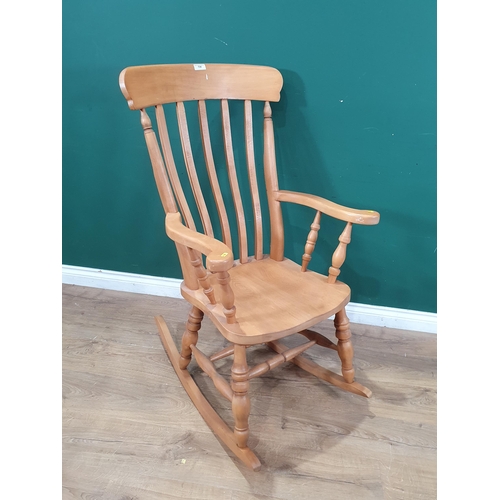 739 - A beech wood lathe back Rocking Chair with turned supports. (R6).