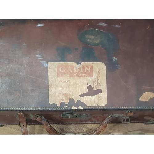 750 - A leather Case containing a small leather case, a canvas covered water Canteen, and a carved Picture... 