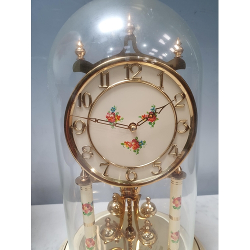 80 - A Kundo 400 day Mantel Clock with floral decoration, under a glass dome, 12in H and a copper Paraffi... 