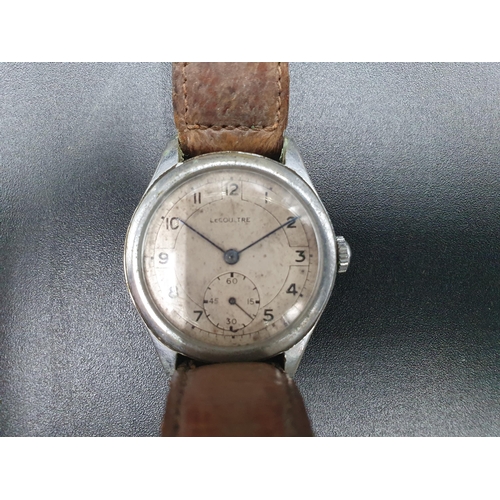88 - A Military Wristwatch, the circular dial with subsidiary seconds dial, inscribed Le Coultre,  the re... 