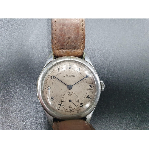 88 - A Military Wristwatch, the circular dial with subsidiary seconds dial, inscribed Le Coultre,  the re... 