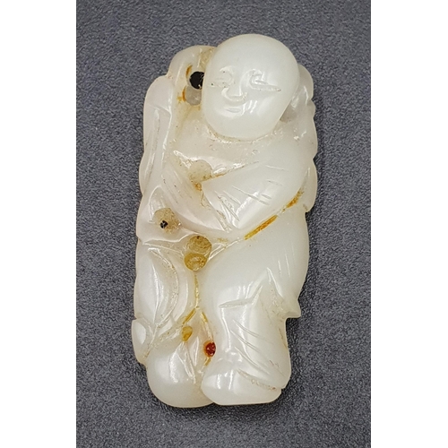 98 - A carved rose pink Pendant with gilt floral mount, and three jade Carvings of fish and lily, two kyl... 