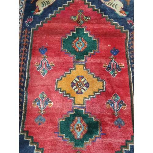 277 - A Persian Rug with bird designs to the corners, 4ft 11in x 3ft and a Ziegler Mat