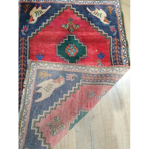 277 - A Persian Rug with bird designs to the corners, 4ft 11in x 3ft and a Ziegler Mat