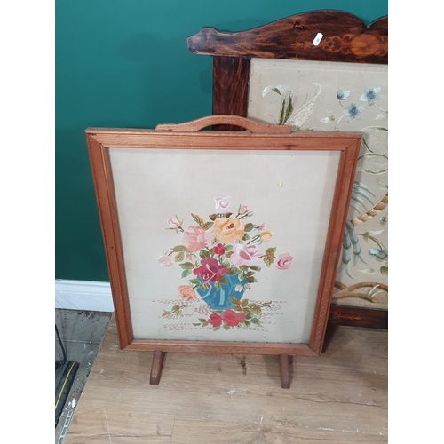 281 - Two needlework Firescreens, a mirror with surround painted birds and an arched Mirror