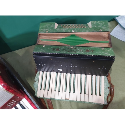 287 - A Mastertone Piano Accordian and Galutta Piano Accordian in case (R2)