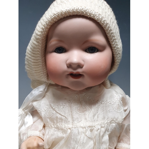 273 - An Armand Marseilles large Baby Doll, No351/10K with sleeping eyes, the open mouth having two teeth,... 