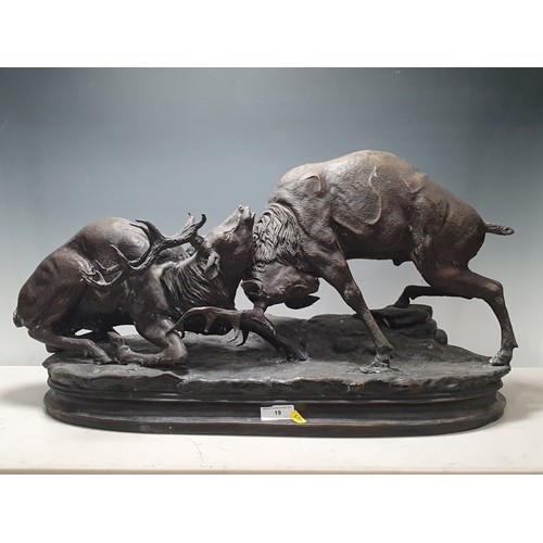 19 - A spelter Sculpture displaying two Red Deer Rutting on oval base 2ft 6in L x 1ft 4in H (R7)
