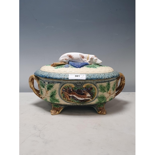 301 - A Minton Majolica Gun Dog Game Pie Dish and Cover, complete with inner Dish, with holly and hare and... 