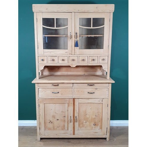 440 - A Pine dresser with Glazed top above two cupboard doors and four drawers H 6ft 3