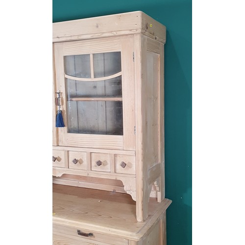 440 - A Pine dresser with Glazed top above two cupboard doors and four drawers H 6ft 3