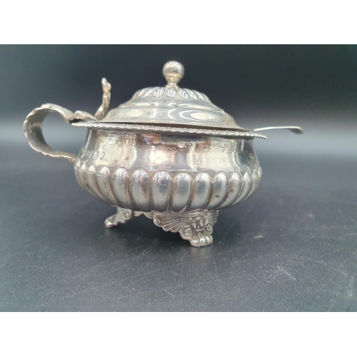 1 - A George III silver large circular Mustard Pot, semi-fluted on anthemion and paw feet, London 1818, ... 