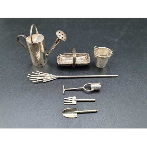 10 - A modern silver miniature Watering Can, Trug, Bucket, Rake, Dibber, Trowel and Fork