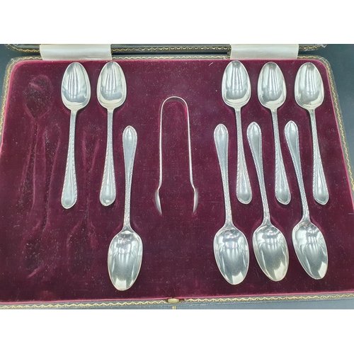 100 - Nine George V silver Teaspoons and Sugar Tongs, Sheffield 1911, in case