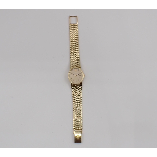 110 - A lady's Rolex manual Wristwatch the oval champagne dial with hourly baton markers on integral 14ct ... 