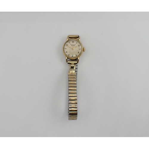 112 - A lady's Longines manual Wristwatch the cream dial with alternating arabic numerals and chevron mark... 