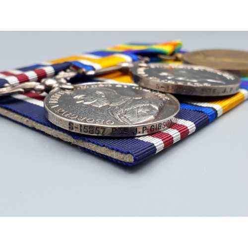 1144 - Three; Military Medal (GV), British War and Victory Medals to S15857 Pte. J.P. Gibson, 14th Battalio... 