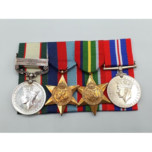 1149 - Four; India General Service Medal 'North West Frontier 1936-37' Clasp, 1939-45 Star, Pacific Star, D... 