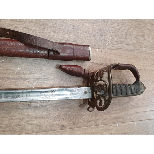 1155 - An 1892 Pattern Infantry Officer's Sword with etched blade by Holt & Son, Sackvilles in leather cove... 