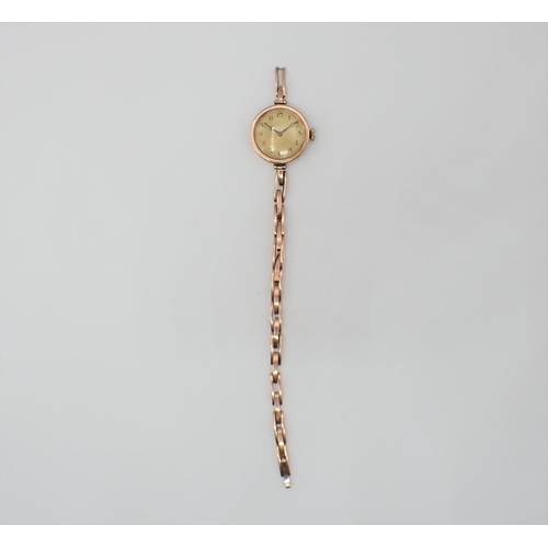 133 - A lady's 1950's Rolex manual Wristwatch the engraved dial with arabic numerals in 9ct gold case, cas... 