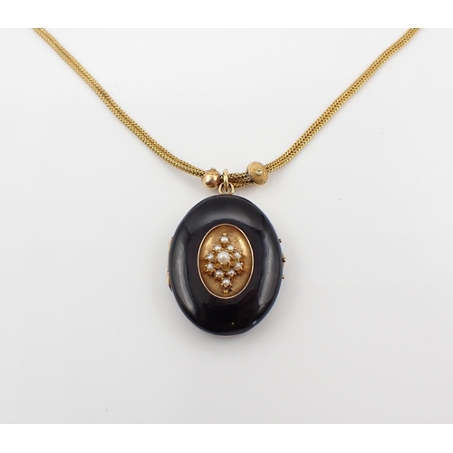 144 - A Victorian black enamel oval Locket the front with central panel set cluster of seed pearls, 28mm x... 