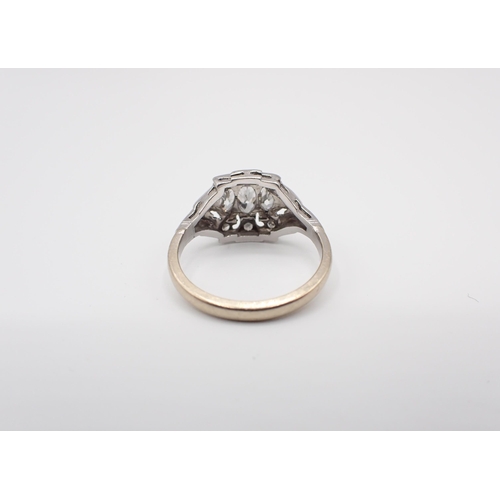 146 - A mid 20th Century Diamond three stone Ring the pierced mount rubover-set graduated marquise-cut sto... 