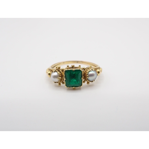 157 - A Georgian Emerald and Pearl Ring close-set step-cut emerald between two pearls in beaded setting, u... 