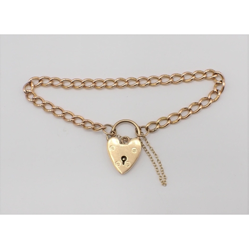 163 - A 15ct gold fine curb link Bracelet on 9ct gold padlock fastener, approx 12.20gms all in