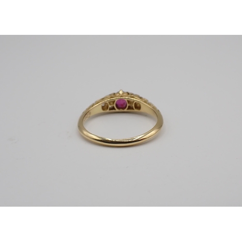 167 - A Victorian Ruby and Diamond Ring claw-set oval-cut ruby between trios of pavé-set old-cut diamonds ... 