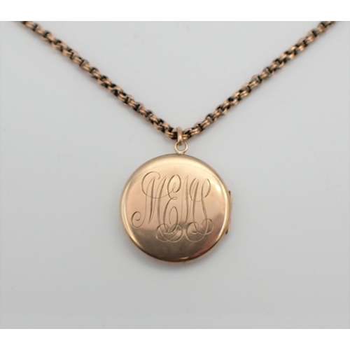 177 - A circular 9ct gold Locket with engine turning and monogram engraved to reverse on chain marked 9C, ... 