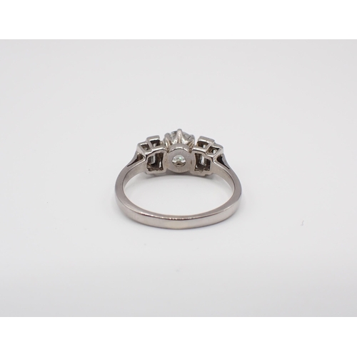 187 - A Diamond five stone Ring claw-set old-cut stone, estimated 1ct, between two pairs of graduated bagu... 