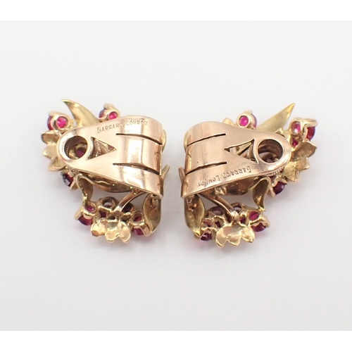 198 - A pair of Ruby Flower Spray Ear Clips each claw-set twelve round stones, marked Garrard, London, unm... 