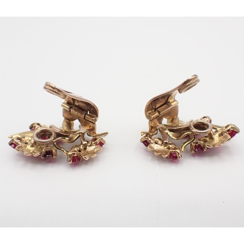 198 - A pair of Ruby Flower Spray Ear Clips each claw-set twelve round stones, marked Garrard, London, unm... 