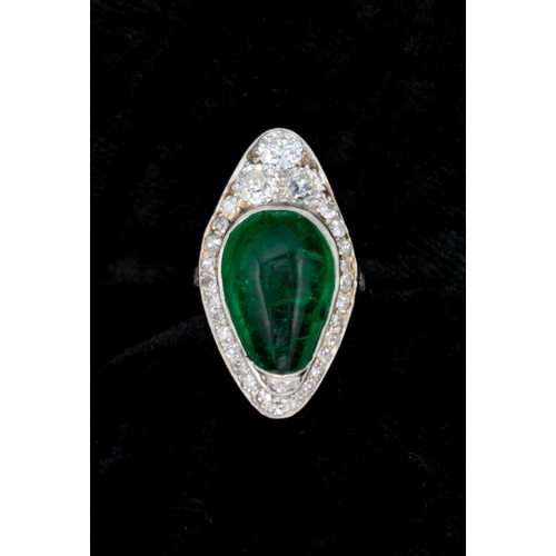 201 - A mid 20th Century Emerald and Diamond Cocktail Ring set irregular shaped emerald cabochon within mi... 