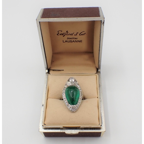 201 - A mid 20th Century Emerald and Diamond Cocktail Ring set irregular shaped emerald cabochon within mi... 