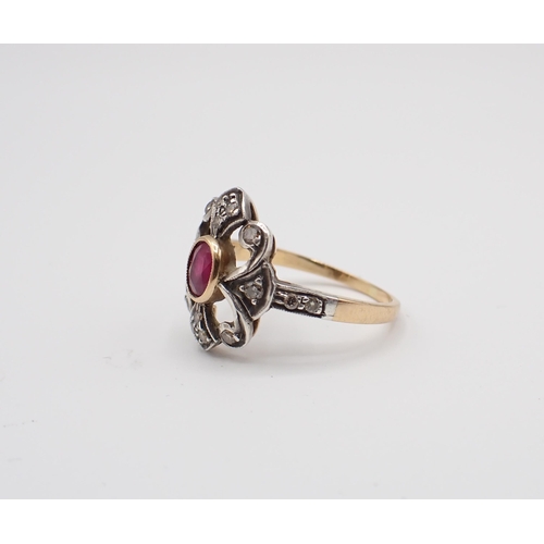 202 - A Ruby and Diamond Cluster Ring rubover-set oval-cut ruby within openwork frame set brilliant-cut di... 