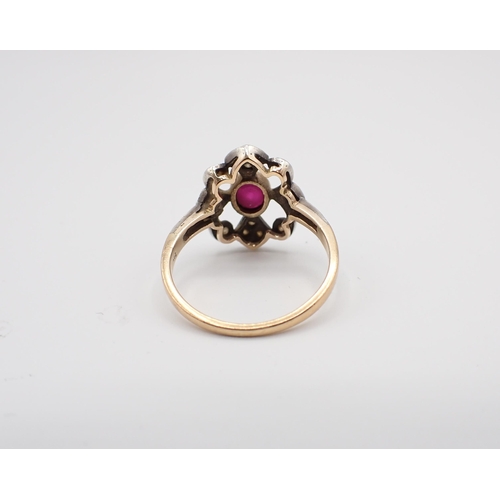 202 - A Ruby and Diamond Cluster Ring rubover-set oval-cut ruby within openwork frame set brilliant-cut di... 