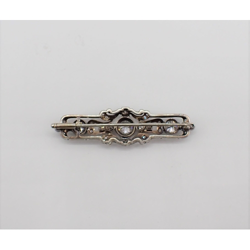 206 - An Art Deco style Diamond Brooch millegrain-set throughout brilliant and eight-cut stones in 14ct wh... 