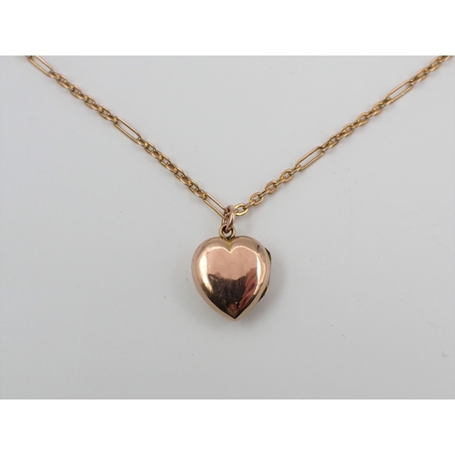 208 - A heart shaped Locket the front set round blue stone within seed pearls on chain marked 9ct, approx ... 