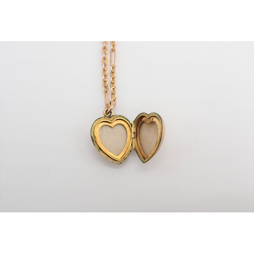 208 - A heart shaped Locket the front set round blue stone within seed pearls on chain marked 9ct, approx ... 